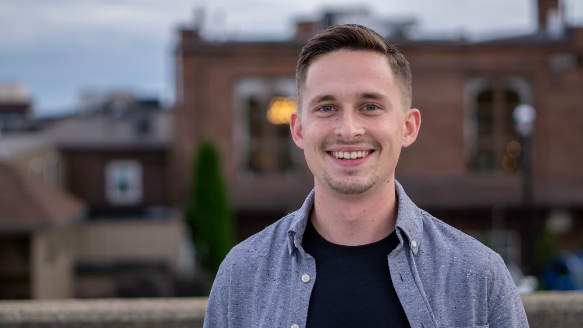 Justin Mancari smiling outdoors